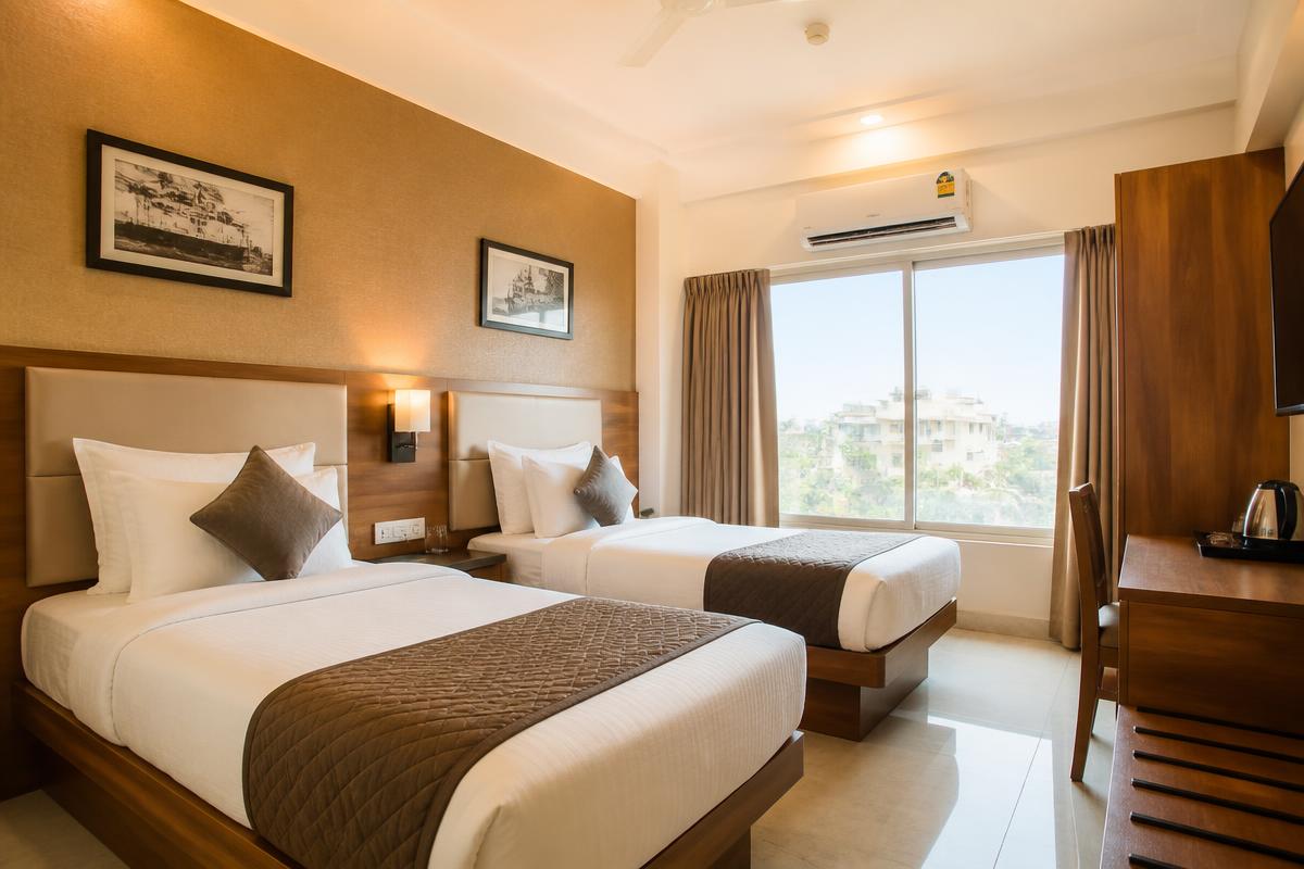 Clean twin-bed hotel room in Shirdi near the Sai Baba temple